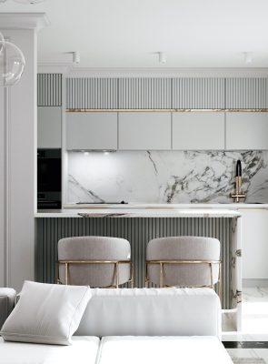Luxury kitchen design in Dubai featuring marble surfaces and modern bar seating